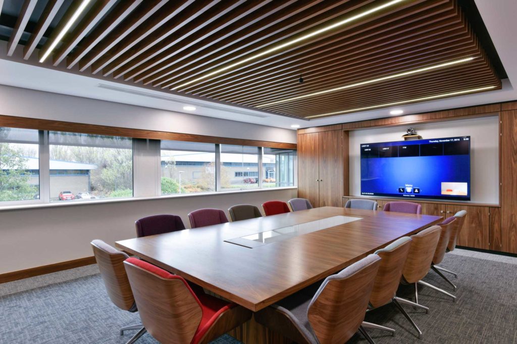 A board room with lighting control, motorised blinds, presentation and conferencing technologies.
