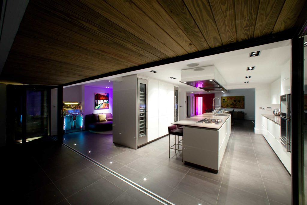 A home kitchen and snug and bifold doors, with a Wurlitzer jukebox.