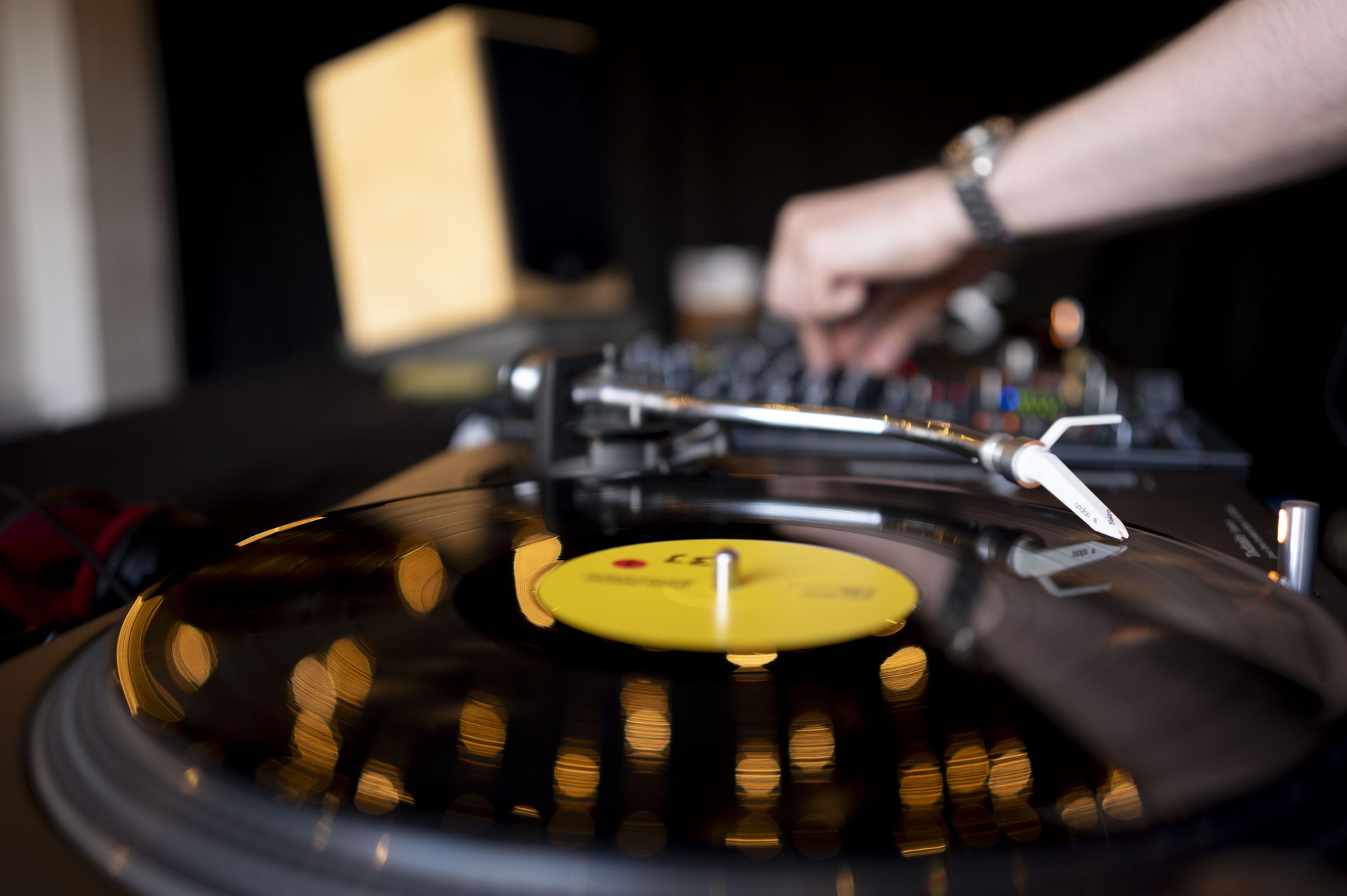 A DJ mixing on Technics turntables at the Clever Association Summer Soiree 2026